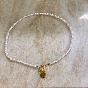 Elegant White Pearl Necklace with Gold Charm